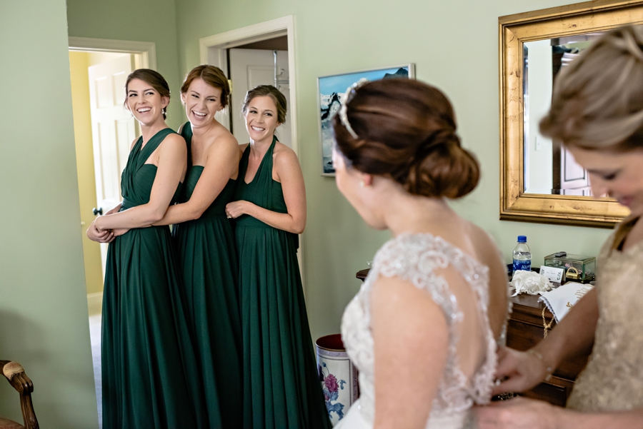 Bridesmaids being silly during the getting ready portion of the wedding day.